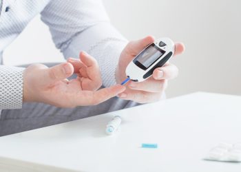 Man using glucose meter