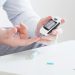 Man using glucose meter